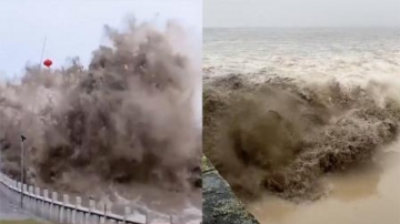 实拍钱塘江大潮 潮水撞向堤坝瞬间激起巨浪 岸上人潮汹涌不断惊呼