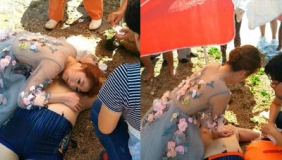 【拍客】陌生男子突发心脏病溺水 海边拍照新娘穿婚纱救人