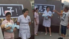 【拍客】河南周口医生护士被逼抱尸示众 遭辱骂扇耳光