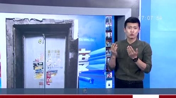 大妈图省事用杯子挡电梯门 引发电梯“爆炸”