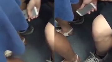 男子在地铁上偷拍女乘客裙底 不料被另一乘客全程拍下