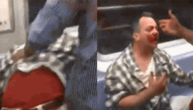 堪比大片！实拍纽约地铁上演车厢混战 男子负伤满脸是血