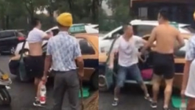 实拍常德街头凯迪拉克车主和的哥互殴 起因疑似的哥别车