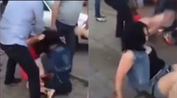 哈萨克斯坦醉酒女子街上斗殴 男性无法阻止