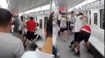 实拍大连地铁上演全武行 红衣男暴打穿“耐克鞋”男子大骂