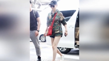 李宇春“红配绿”玩下装消失秀白皙长腿